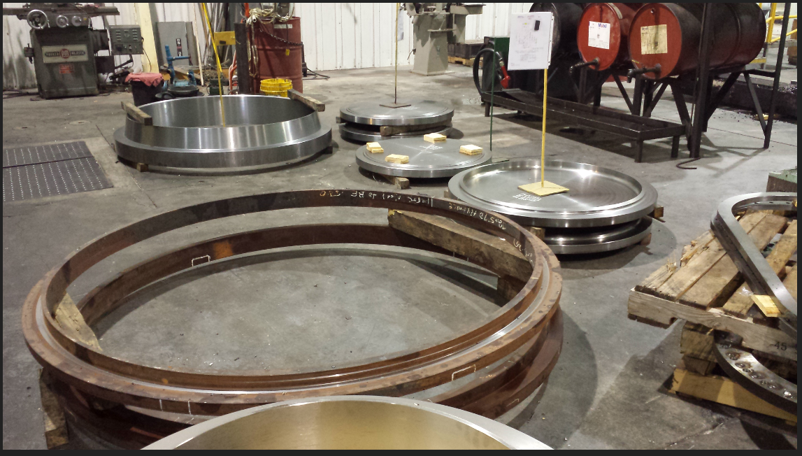 Large industrial girth flanges on factory floor ready for shipping